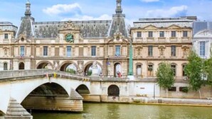 A historic building with a bridge over a river, featuring classical architecture and multiple arches. - 318 Suite Pivert - Superb apartment in Paris (Paris 11 Popincourt)