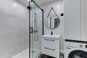 Shower, hair dryer, towels, soap