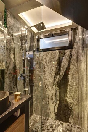 Shower, hair dryer, towels, soap