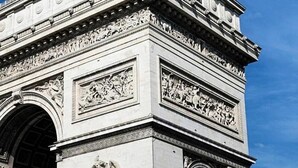 A large, ornate stone archway with intricate carvings and sculptures. - 366 Suite Legendre - Superb apartment in Paris (Paris 17 Batignolles-Monceau)