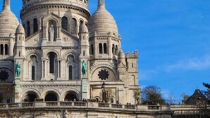 A large, historic building with multiple domes and arched windows. - 258 Suite Orsel - Superb apartment in Paris (Paris 18 Buttes-Montmartre)
