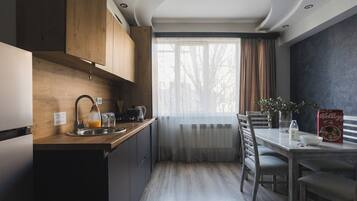 Fridge, stovetop, highchair, cookware/dishes/utensils