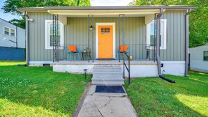 A single-story house with a front porch, two chairs, and a door. - Danville Rental, Walk to Caesars Virginia Casino (Danville)