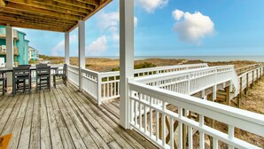 A wooden deck with white railings overlooking a beach. - ☀️Ocean Oasis- Oceanfront w/Stunning Views-Pet Friendly☀️ (Carolina Beach)