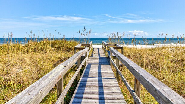 A wooden boardwalk leading to a beach with a clear sky. - ☀️Ocean Oasis- Oceanfront w/Stunning Views-Pet Friendly☀️ (Carolina Beach)
