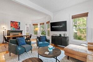 TV, fireplace, books, music library