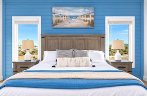 Settle into a comfortable bed framed by coastal-inspired details and plenty of natural light for a relaxing retreat at the end of the day.