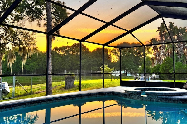 Golden hour turns the lanai into a living painting as the sky glows.