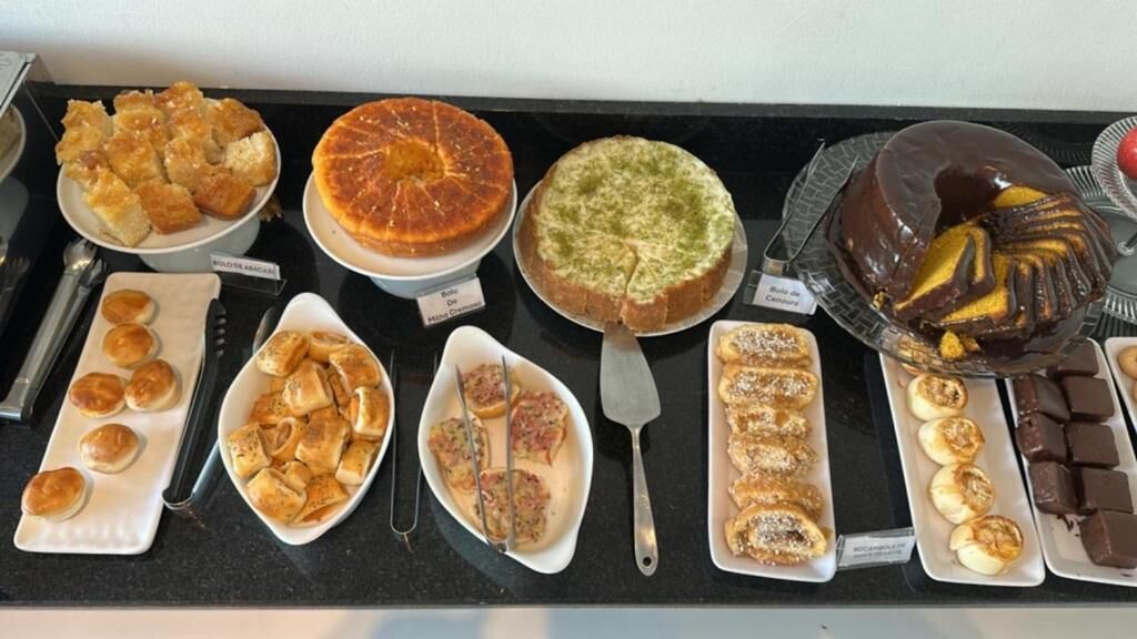 A variety of desserts on display, including cakes, pastries, and cookies.