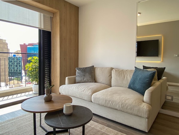 Apartment (905A) | Living area | 40-inch TV with cable channels