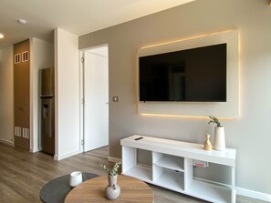 Apartment (905A) | Living area | 40-inch TV with cable channels