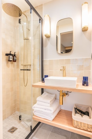 Shower, hair dryer, towels, soap