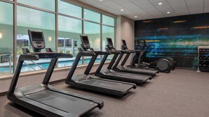 A gym with treadmills, a pool, and a motivational wall. - Tru By Hilton Ankeny (Ankeny)