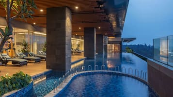 Outdoor pool, open 6:00 AM to 10:00 PM, free cabanas