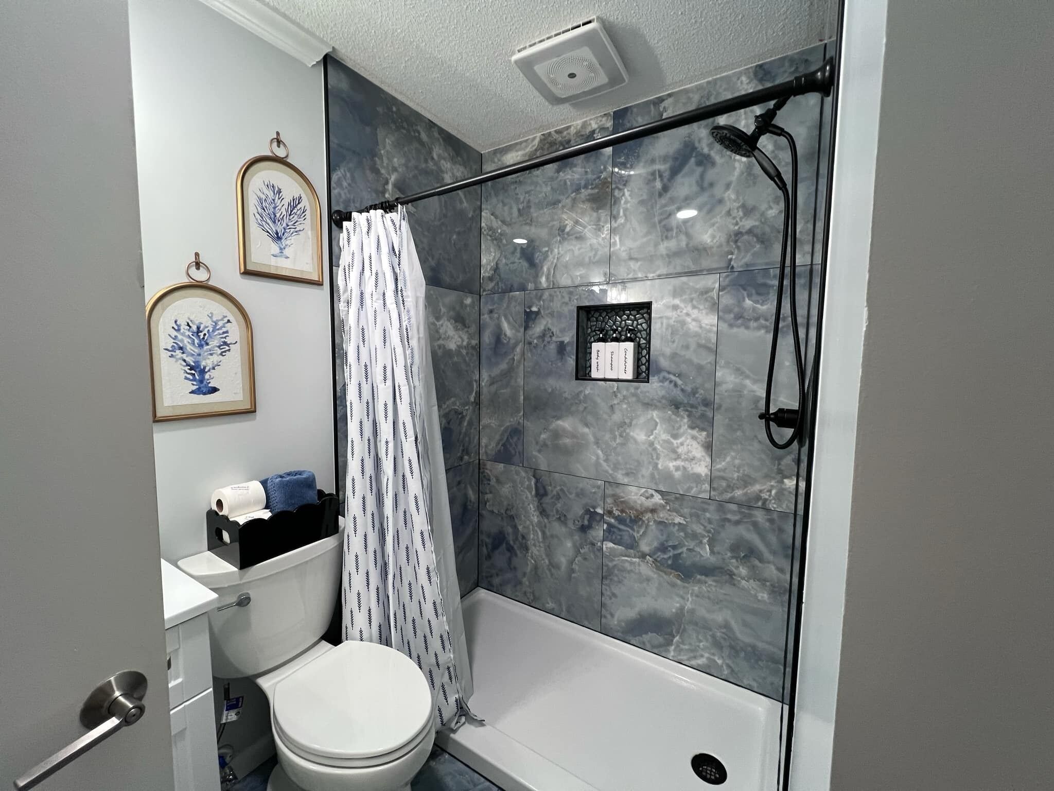 Shower, hair dryer, towels, soap
