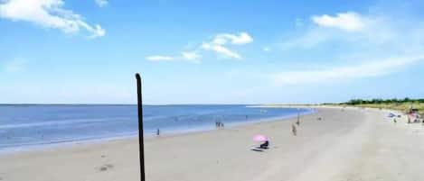 On the beach, sun-loungers, beach towels