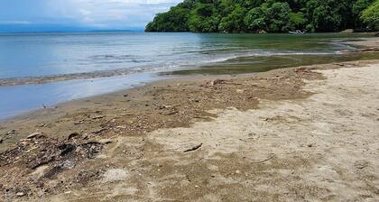 Cozy 2-bedroom house, WiFi, AC in Playa Pajaros, minutes away from MANY beaches!