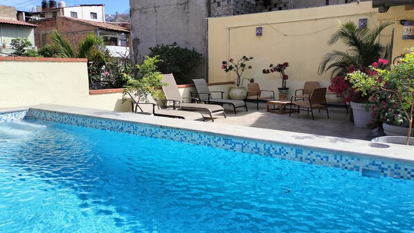 Outdoor pool, open 10:00 AM to 10:00 PM, pool loungers - Victoria Suites (Puerto Vallarta)