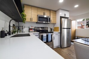 Fridge, microwave, oven, stovetop - West Seattle Bungalow - Full Kitchen & Yard (Seattle)