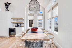 Enjoy cooking in this well-equipped kitchen with a central island, oven, and coffee machine.