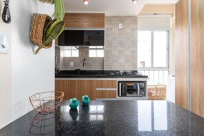 Fridge, microwave, stovetop, coffee/tea maker