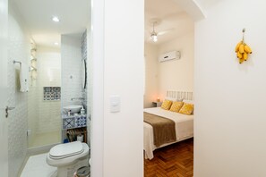 Shower, hair dryer, towels, toilet paper