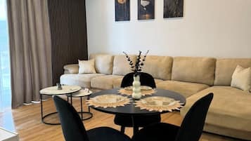 Deluxe Apartment, City View | Living area | 42-inch Smart TV with cable channels