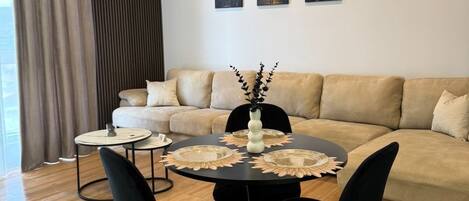 Deluxe Apartment, City View | Living area | 42-inch Smart TV with cable channels