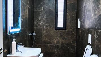 Apartment, 2 Bedrooms | Bathroom | Shower, rainfall showerhead, hair dryer, slippers