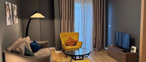 Deluxe Apartment, City View | Living area | 42-inch Smart TV with cable channels