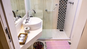 Shower, hair dryer, towels, shampoo