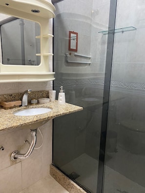 Shower, hair dryer, towels, shampoo