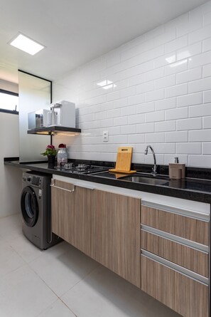 Fridge, microwave, coffee/tea maker, cookware/dishes/utensils