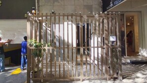 A building entrance with a gated area, tiled pavement, and a sign reading "Maria Filó". - 3 minutes from Copacabana beach | STC303 (Rio de Janeiro)