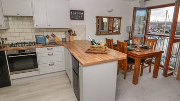 Fridge, electric kettle, toaster, cookware/dishes/utensils