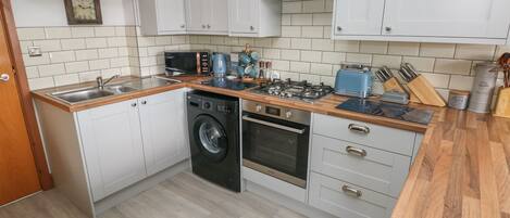Fridge, electric kettle, toaster, cookware/dishes/utensils