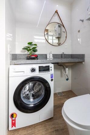 Shower, hair dryer, towels, shampoo