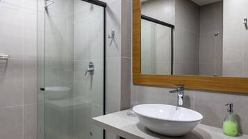 Shower, hair dryer, towels, shampoo