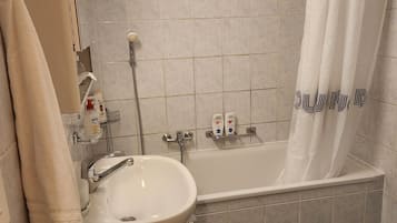Hair dryer, towels, soap, toilet paper