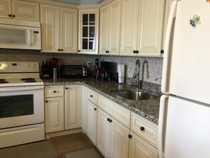 Enjoy meal preparation in this well-equipped kitchen with ample space for cooking and entertaining.