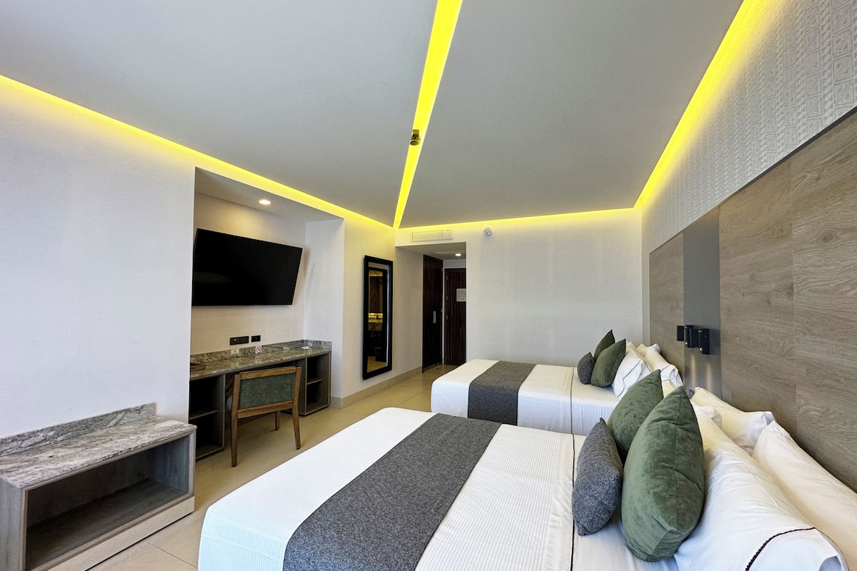 Habitación estándar, 2 camas matrimoniales | 1 habitación, ropa de cama de alta calidad y edredón
