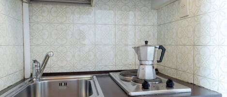 Fridge, microwave, stovetop, coffee/tea maker