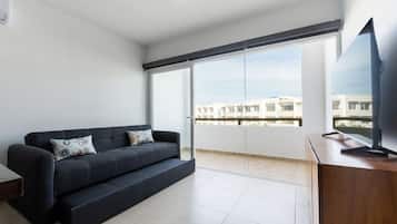 Family Condo | Living area | 50-inch flat-screen TV with digital channels, Netflix