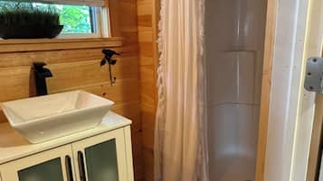 Shower, hair dryer, towels, toilet paper
