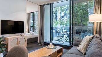 City Apartment | Living room | 35-inch Smart TV with digital channels, Netflix, streaming services