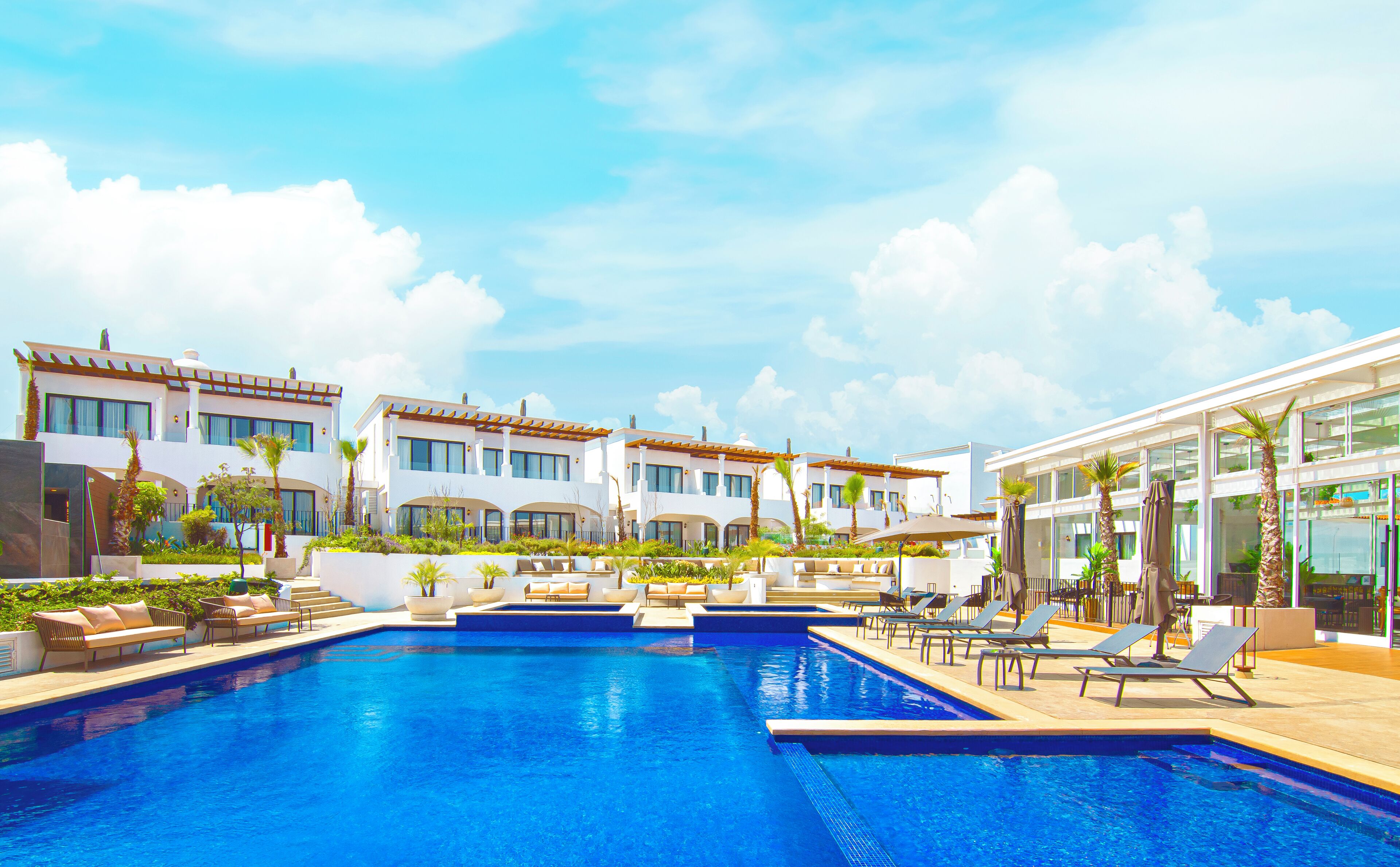 Outdoor pool, open 10:00 AM to 10:00 PM, pool umbrellas, sun loungers