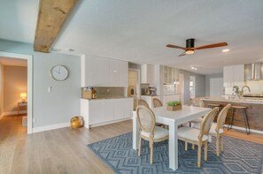 Enjoy cooking in this well-equipped kitchen with a central island and ample dining space.