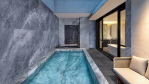 A modern bathroom with a marble pool, a shower area, and a seating area with a view of the pool. - Ascott Tianfu CBD Chengdu (Chengdu)