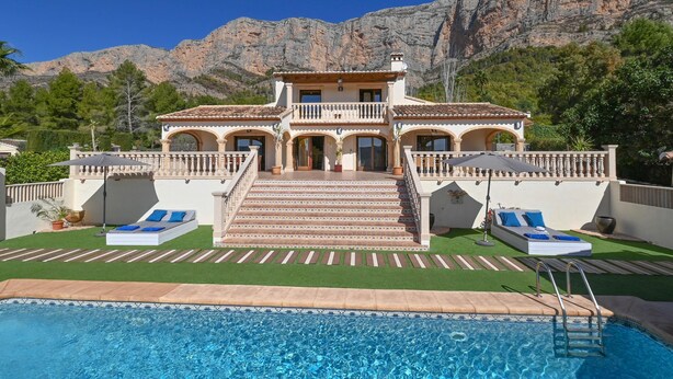 A large house with a swimming pool, stairs leading to the entrance, and a mountain backdrop. - Wonderful and comfortable villa in Javea, Costa Blanca, Spain  with private pool for 4 persons (Javea)