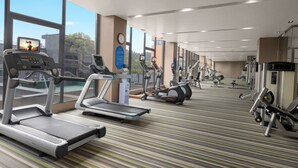 A gym with treadmills, elliptical machines, and weight equipment. - Citadines Nanhai Foshan (Foshan)